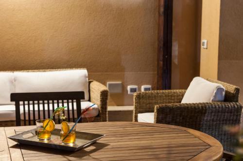 a table with a tray of drinks on top of it at B&B Villa Seta in Agrigento