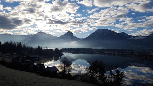 a view of a lake with mountains in the background at residenz5360 in St. Wolfgang