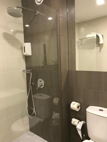 a bathroom with a shower with a glass door at Hotel do Parque in Viana do Castelo