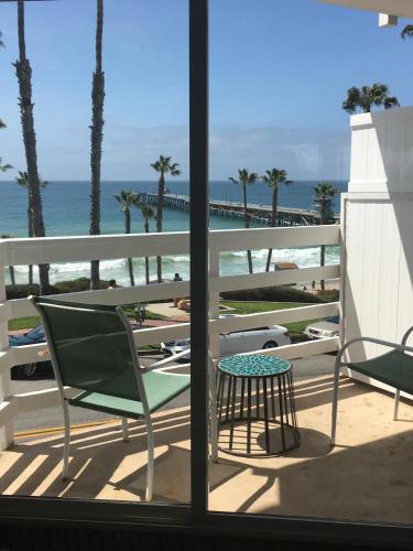 a balcony with a view of the beach and the ocean at Sea Horse Resort in San Clemente