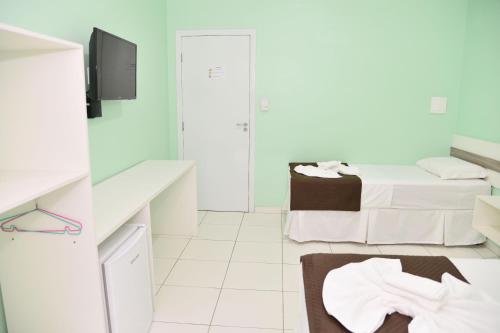 TV a/nebo společenská místnost v ubytování Pousada Pé De Arruda
