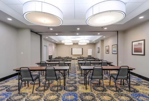 a classroom with tables and chairs in a room at Best Western Plus Hanes Mall in Winston-Salem