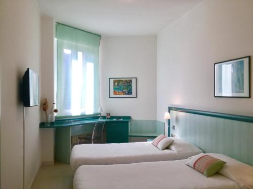 Postel nebo postele na pokoji v ubytování Hotel Europa