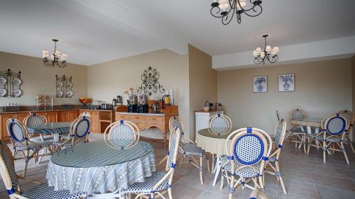 a dining room with a table and chairs at Carmel Bay View Inn in Carmel
