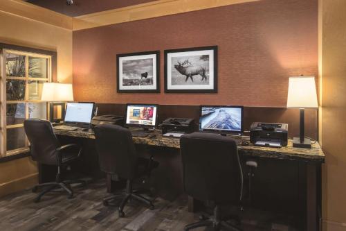 an office with a desk with computers and chairs at Best Western Ramkota Hotel in Rapid City