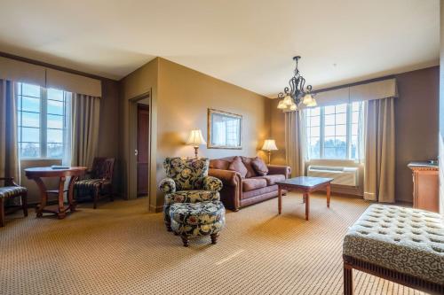 a living room with a couch and a chair at The Wildwood Hotel in Wildwood
