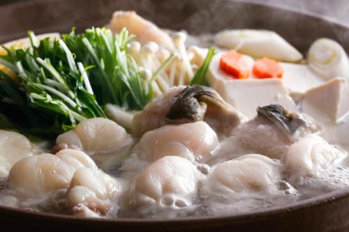 a bowl of soup with shrimp and vegetables in it at Hanagoyomi in Sumoto
