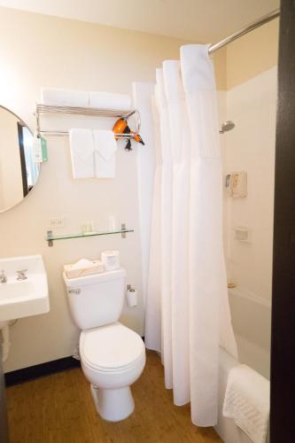 a bathroom with a toilet and a sink and a shower at Stay Hotel Waikiki in Honolulu