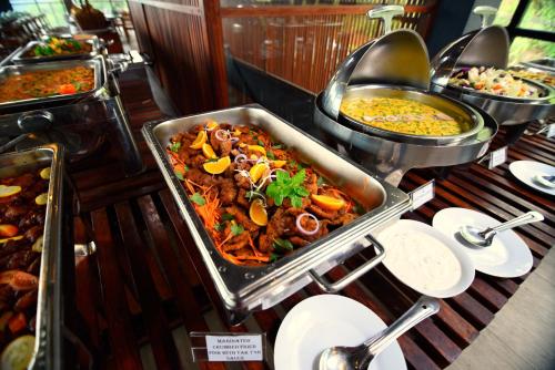 a buffet with many different types of food on a table at Oak Ray Tea Bush in Ramboda