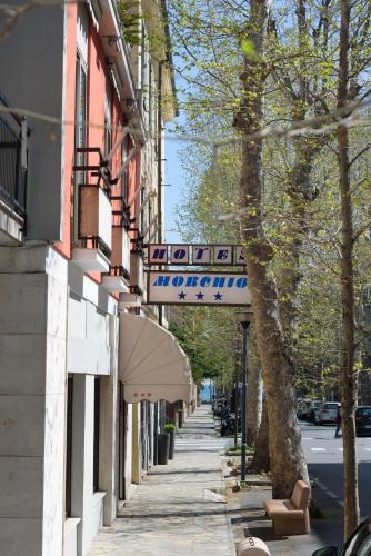 a street with a sign on the side of a building at Hotel Morchio Mhotelsgroup in Diano Marina