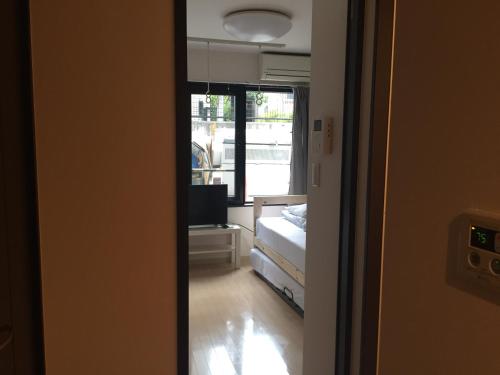 Ένα ή περισσότερα κρεβάτια σε δωμάτιο στο Sophiearth Apartment