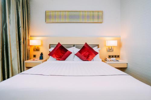 Kama o mga kama sa kuwarto sa Hotel Granada Johor Bahru