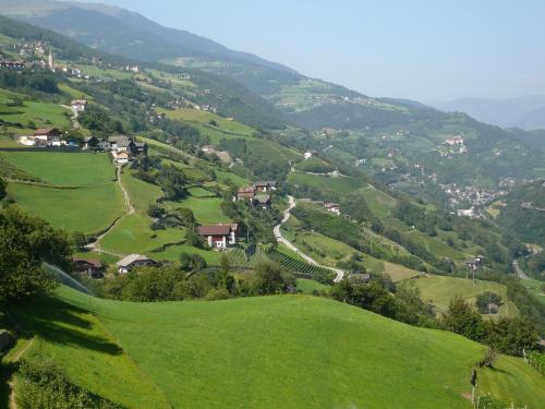 a view of a valley with green hills at Planatscherhof in Barbiano