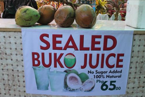 a sign for a sold buluana juice on a table at Deep Forest Garden Hotel in Puerto Princesa City