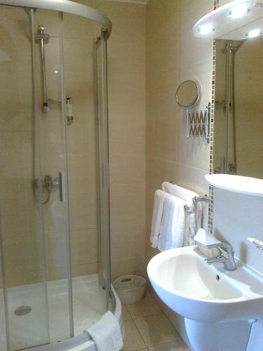 a bathroom with a shower and a toilet and a sink at Gilija in Šilutė