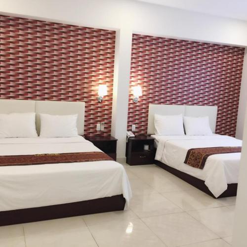 Katil atau katil-katil dalam bilik di Lilly Hotel