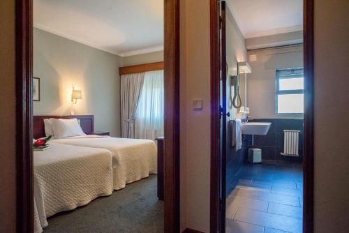 Ένα ή περισσότερα κρεβάτια σε δωμάτιο στο Hotel Boavista II