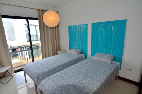 Ένα ή περισσότερα κρεβάτια σε δωμάτιο στο Vilas Espírito Santo