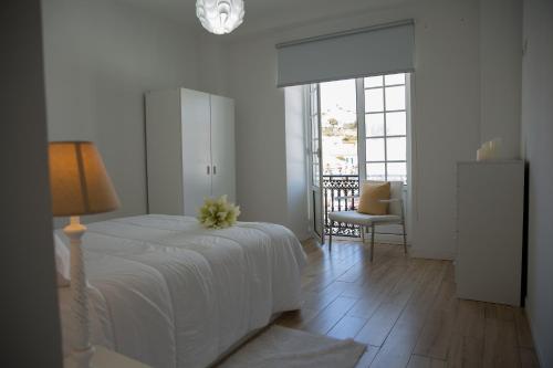 Ένα ή περισσότερα κρεβάτια σε δωμάτιο στο Azores Horta Apartments T0