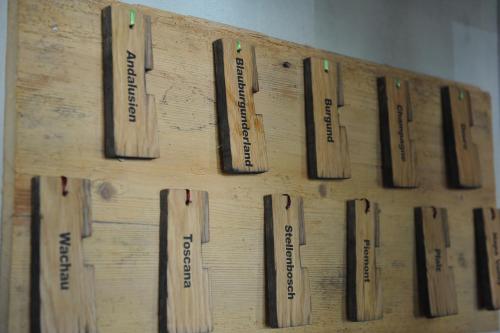 a bunch of baseball bats hanging on a wall at Rüedi - WeinFassHotel in Trasadingen
