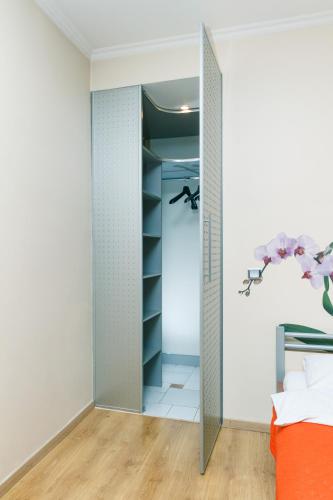 a bedroom with a closet with a mirror at Apartments on Independence Square in Kyiv