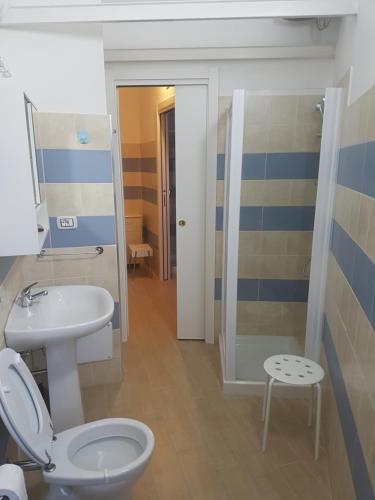 a bathroom with a toilet and a sink at B&B Piazza Dante Nuoro in Nuoro