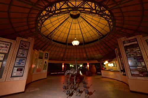 a group of bikes parked in a building with a ceiling at Kilima Safari Camp in Amboseli