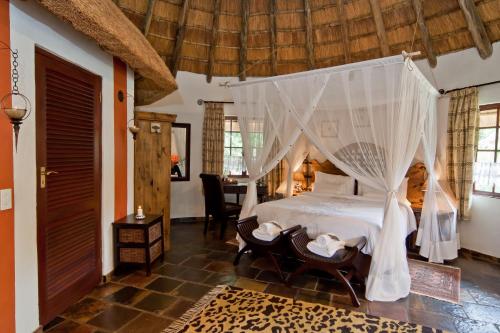 Katil atau katil-katil dalam bilik di Aquanzi Lodge