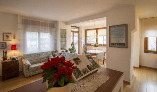 a living room with a couch and a table at Ca' Ada in Faver