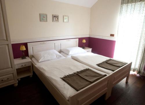 Ένα ή περισσότερα κρεβάτια σε δωμάτιο στο Turistična kmetija Weiss