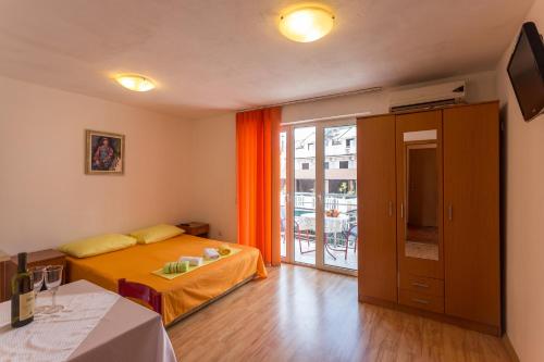 Ένα ή περισσότερα κρεβάτια σε δωμάτιο στο Apartmani Spaic