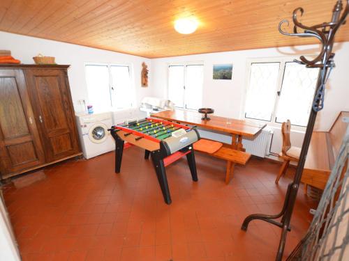 a room with a table with a chess board on it at Chalet in Ore Mountains near Ski Slopes in Jindřichovice