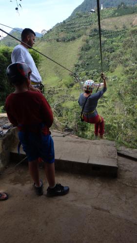 a group of people on a rope swing at Sergeant Pepper's Hostel in Jardin