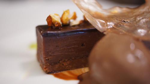 a piece of chocolate dessert on a white plate at Les Florets in Gigondas