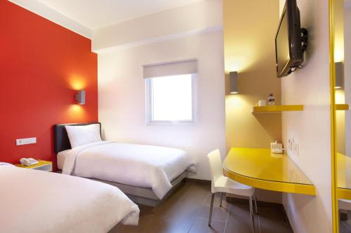 Postel nebo postele na pokoji v ubytování Amaris Hotel Cimanuk Bandung