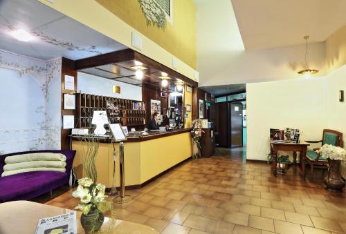 a room with a bar in the middle of a store at Hotel Residence Sogno in Novara