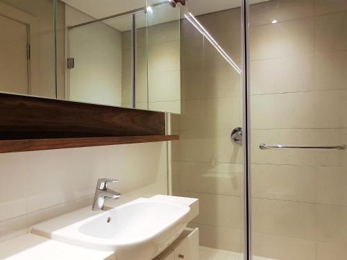 a bathroom with a sink and a shower at Zimbali Suites 301 in Ballito