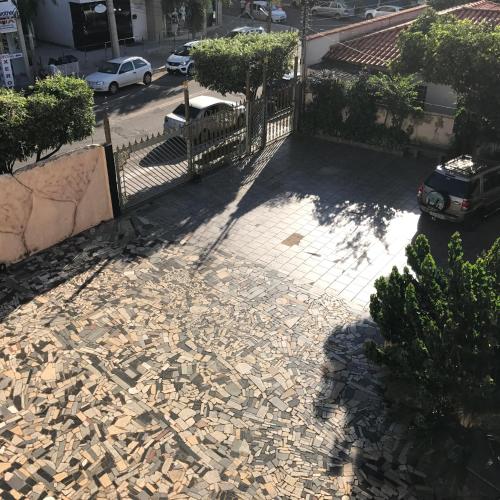 an overhead view of a sidewalk with a fence and a street at Pousada Castelinho in Caldas Novas