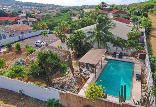 an aerial view of a house with a swimming pool at Bantopa Apartments in Willemstad