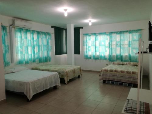 מיטה או מיטות בחדר ב-Francisco Habitaciones