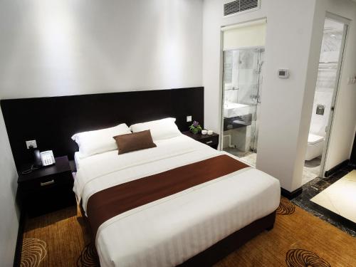 Ένα ή περισσότερα κρεβάτια σε δωμάτιο στο InnB Park Hotel