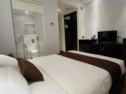 Ένα ή περισσότερα κρεβάτια σε δωμάτιο στο InnB Park Hotel