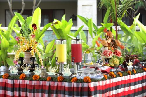a buffet of food on a table at Best Western Premier Agung Resort Ubud in Ubud