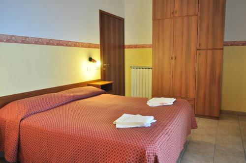 Postel nebo postele na pokoji v ubytování Albergo Villa Margherita