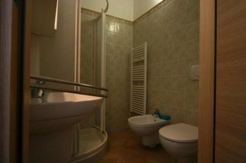 a bathroom with a toilet and a sink at B&B La Baia Di Fiascherino citr01101sei-BEB-0011 in Tellaro