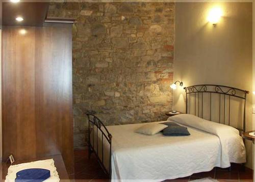Posteľ alebo postele v izbe v ubytovaní Casa Vacanze Vertine