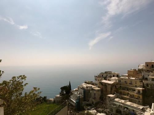 a view of the ocean from a city at Villa Yiara in Positano