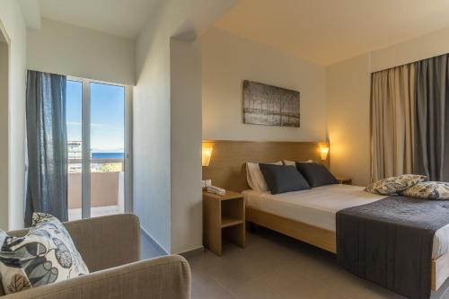 a hotel room with a bed and a window at City Center Hotel in Rhodes Town