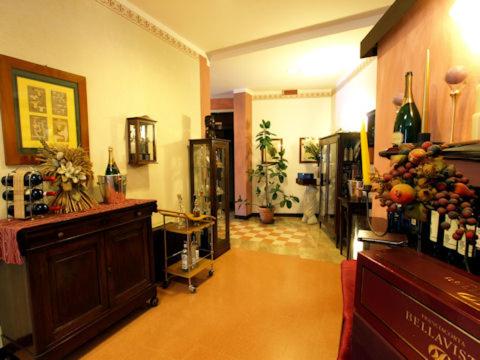 a living room with a room with a wine tasting room at Hotel Enrichetta in Desenzano del Garda