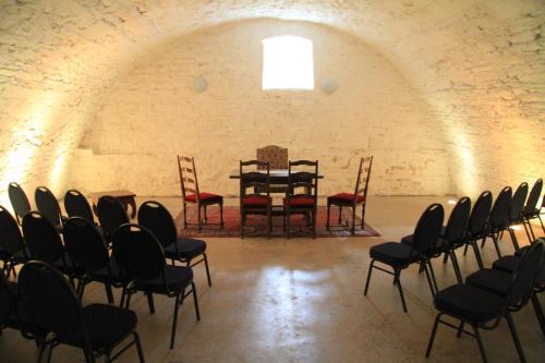 a room with a table and chairs in it at Schloss Hotel Wallhausen in Wallhausen
